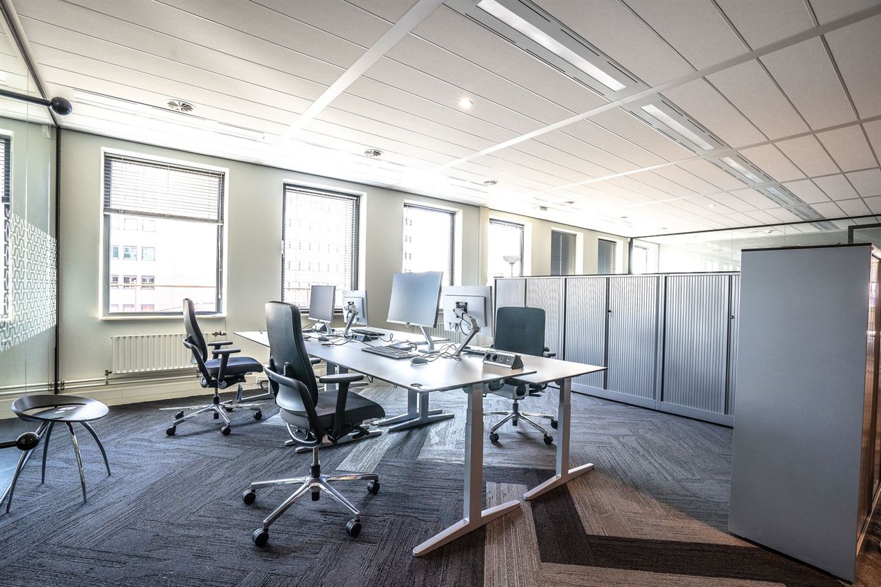 A bright modern office with desks